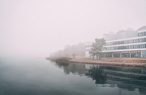 A foggy view of Campus Gräsvik from the water