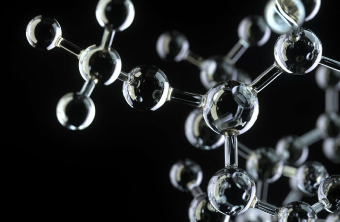 Foto föreställande molekyler i glas